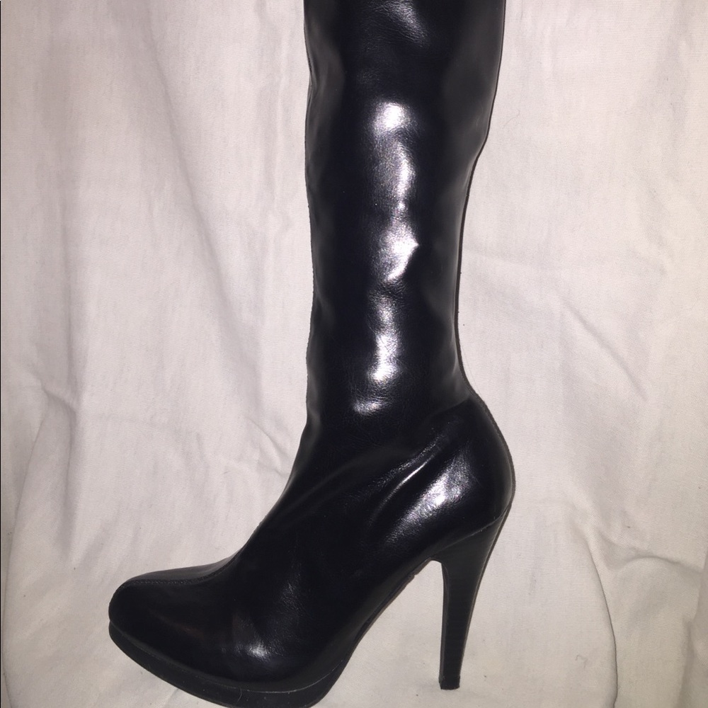Knee height black heels. Never worn!